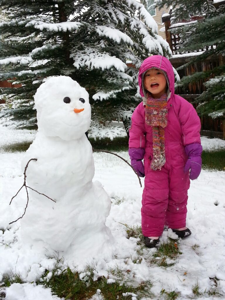 snow-play-kid-and-snowman