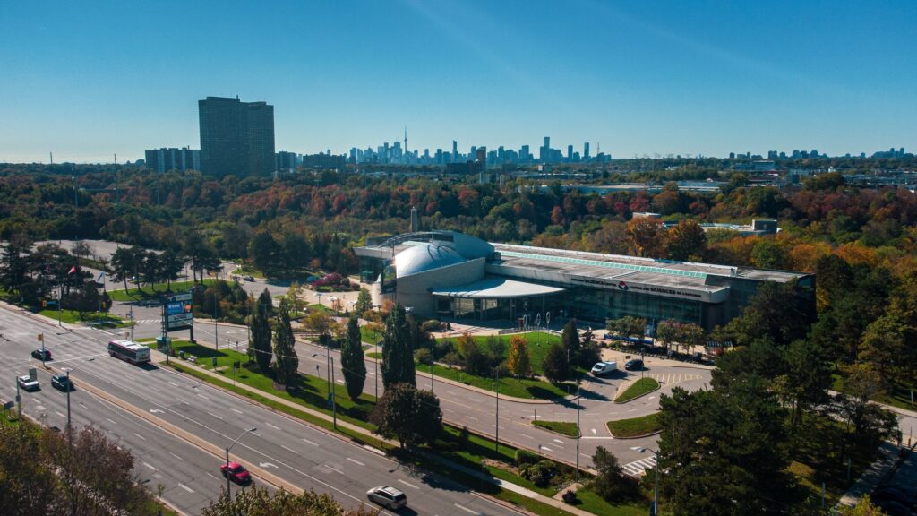 Ontario-Science-Centre-ariel-drone-city-skyline-distant-CN-Tower-datime_Attractions_Image-large